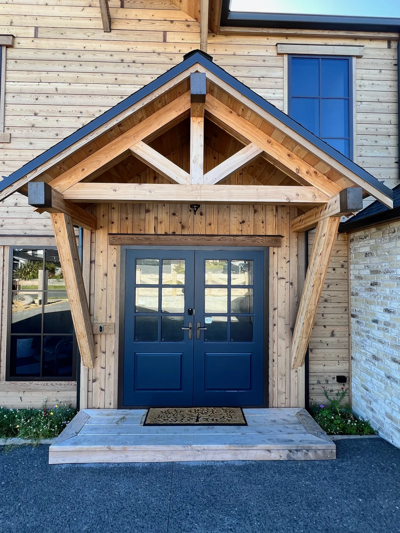 Front entry with cedar, Belgian brick and timber gable